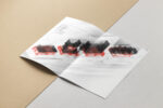 A booklet with an abstract illustration of a kitchen inside.