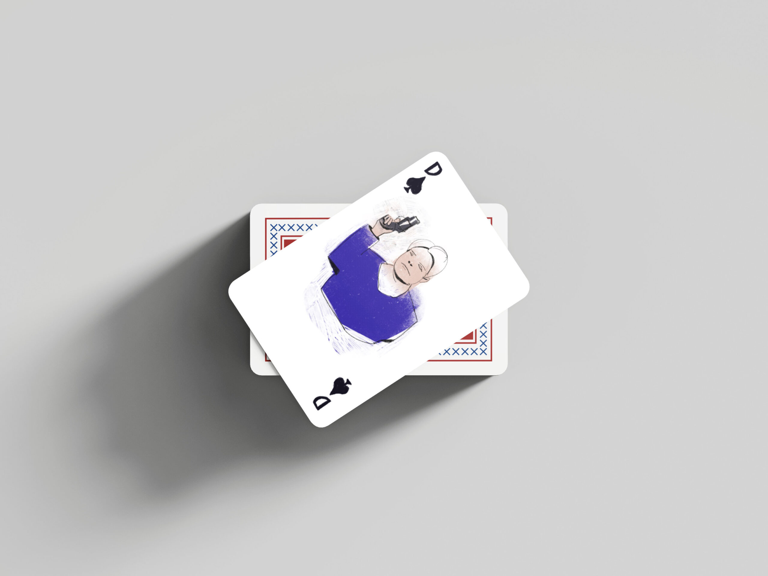 playing card with the illustration of a woman holding a gun in the air