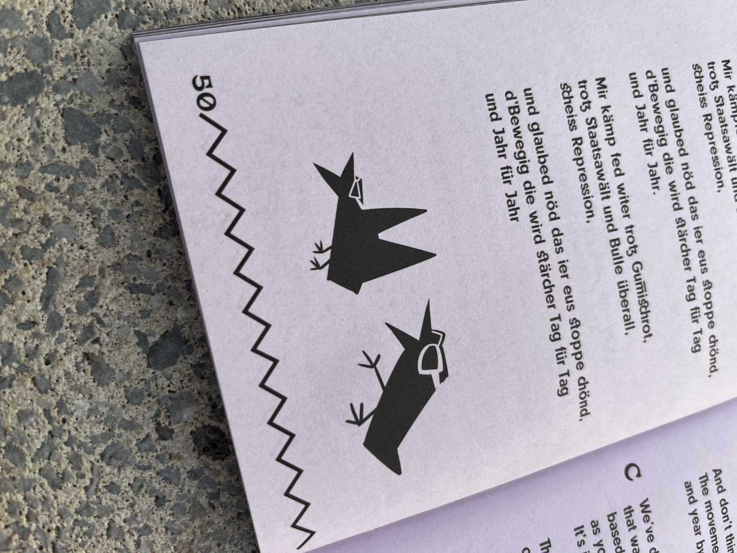 a lilac song book with tiny bird illustrations